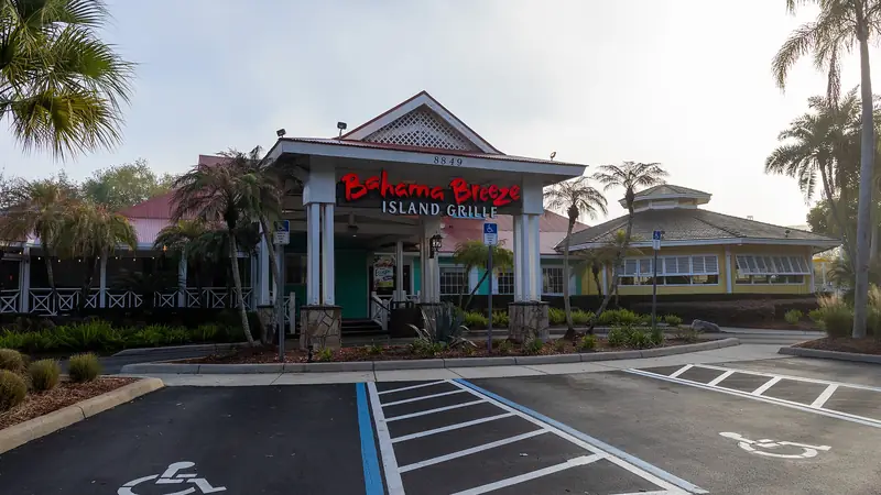 A restaurant frontage with palm trees on International Drive, Orlando