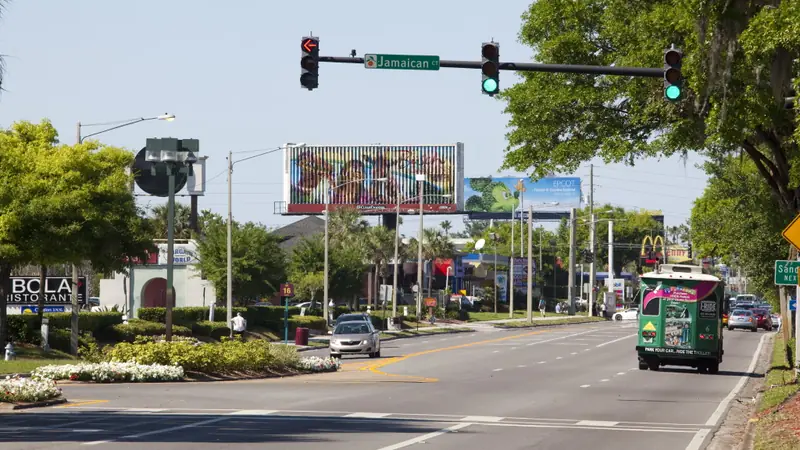 International Drive in Orlando with a green I-RIDE Trolley heading along the road
