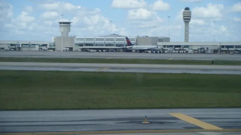 Orlando International Airport's terminal and control tower seen from an arriving plane