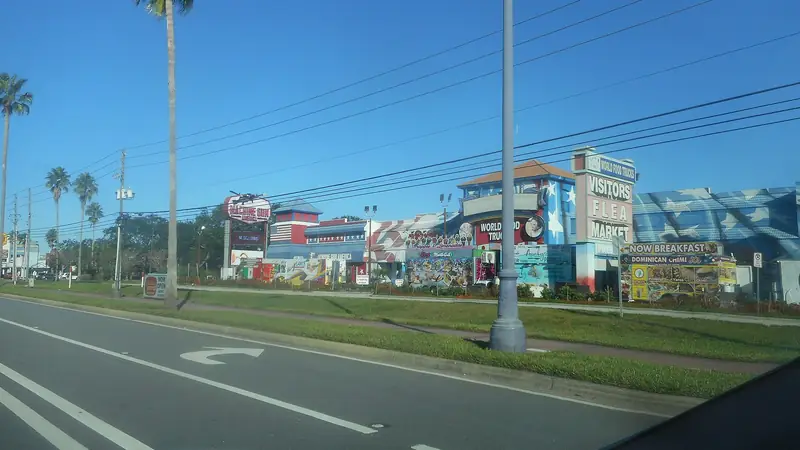 US 192 in Kissimmee, lined with palm trees and roadside signs